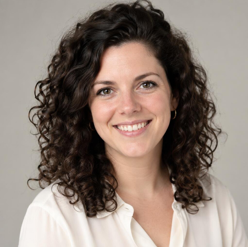 Studio portrait of a woman with curly hair