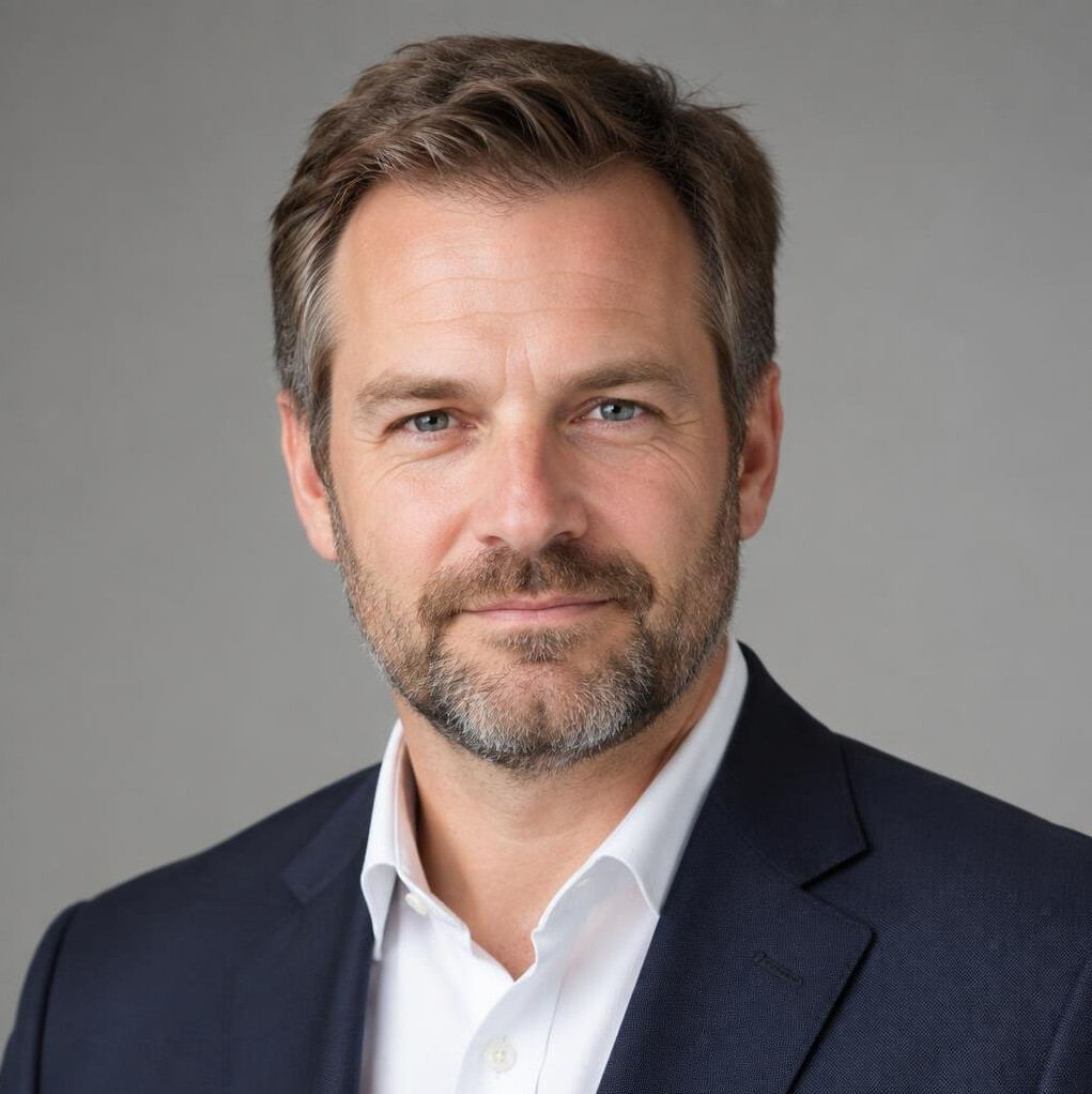 Studio portrait of a bearded man in business attire